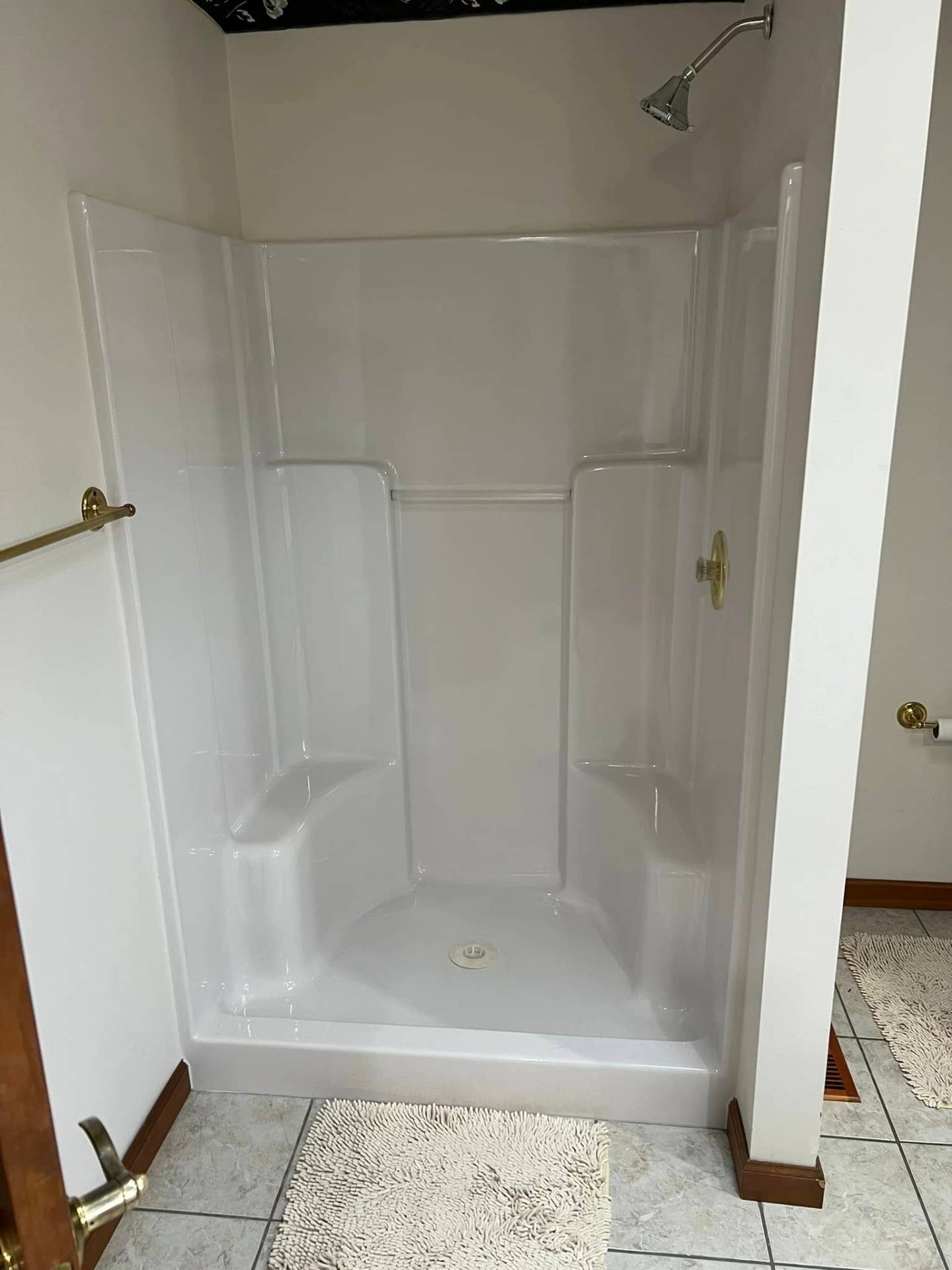 Plain white shower stall before upgrade